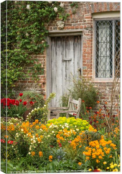 Quintessential vibrant English country garden scene landscape with fresh Spring flowers in cottage garden Canvas Print by Matthew Gibson