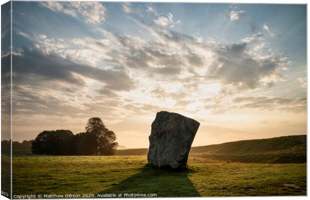 Stunning Summer sunrise landscape of Neolithic standing stones in English cluntryside with gorgeous light with slight background mist Canvas Print by Matthew Gibson