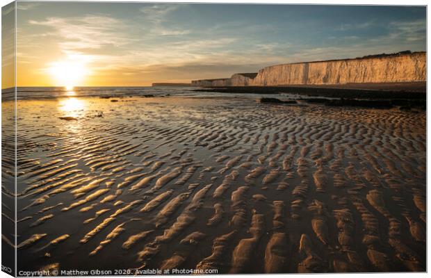 Beautiful vibrant Summer landscape sunset image of Seven Sisters chalk cliffs in England Canvas Print by Matthew Gibson