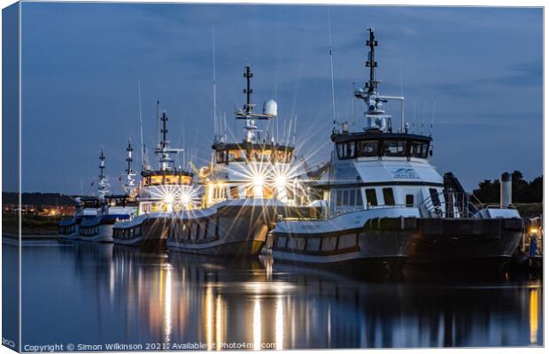 Work Boats in the Harbour Canvas Print by Simon Wilkinson