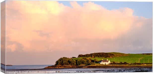 Evening sunlight over Ross bay to Ross cottage Canvas Print by Hugh McKean