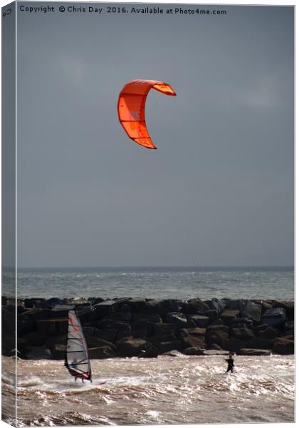 A kite surfer and wind surfer Canvas Print by Chris Day