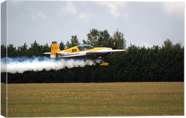 Extra 300 aerobatic plane taking off Canvas Print by Chris Day