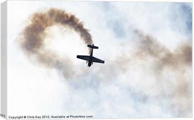 Extra 300 aerobatic plane and smoke trail Canvas Print by Chris Day