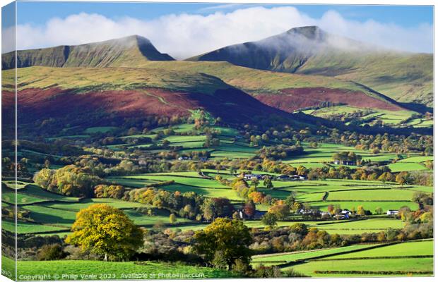 Pen y Fan and Cribyn's Mist Shrouded Peaks. Canvas Print by Philip Veale