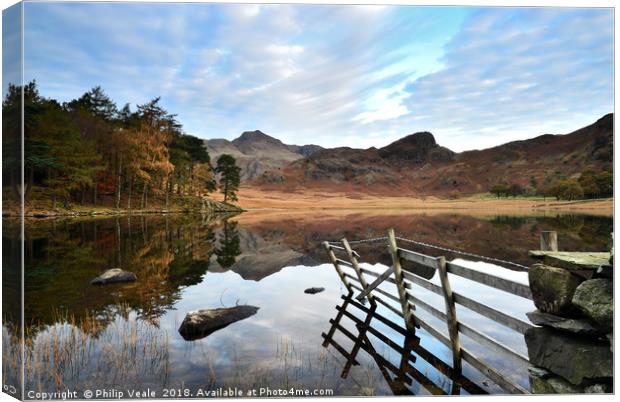Blea Tarn's Dawn Reflection of Serenity. Canvas Print by Philip Veale