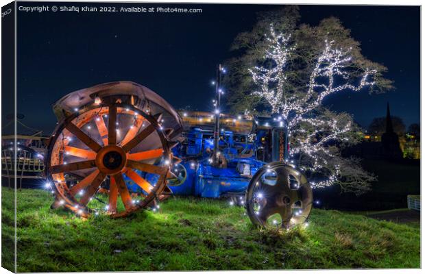 Tractor & Tree covered in Christmas fairy lights Canvas Print by Shafiq Khan