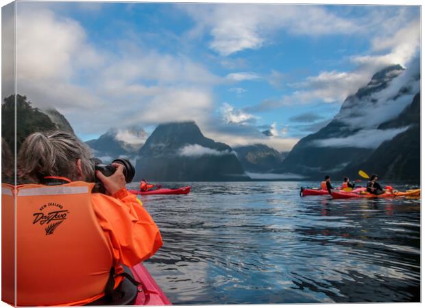 Kayaking on Milford Sound between the Mountains in Canvas Print by Chantal Cooper