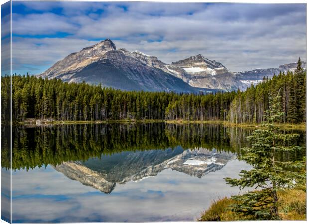 Mountain reflections in lake Canvas Print by Chantal Cooper