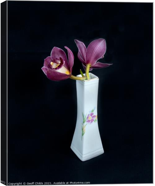  Pretty pink Cymbidium Orchid in a Vase on black. Canvas Print by Geoff Childs