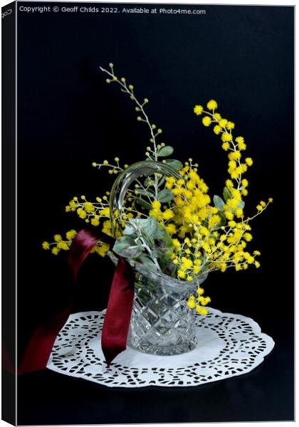 Wattle blossoms in a crystal glass vase vase on black. Wattle da Canvas Print by Geoff Childs