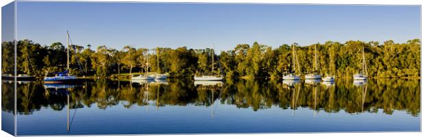Lake landscape waterscape with boat reflections. Canvas Print by Geoff Childs