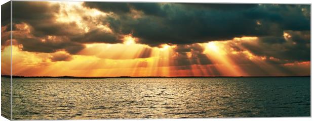 Magnificent golden sun rays. Canvas Print by Geoff Childs