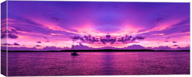  Coastal sunrise seascape in a purple sky.  Canvas Print by Geoff Childs
