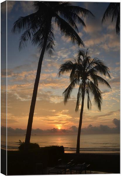 Tropical sunrise seascape with Palm trees at Huay Yang , Thailand. Canvas Print by Geoff Childs