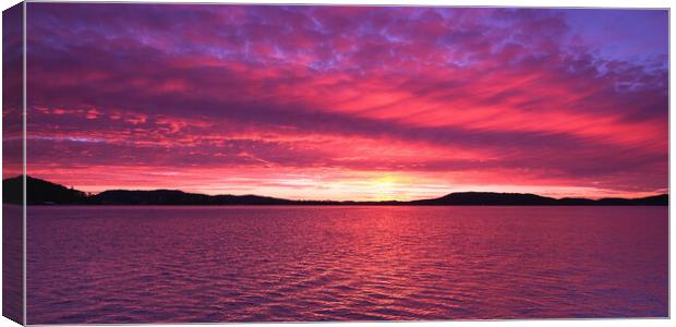 Magenta coloured  Sunrise Seascape Panorama. Canvas Print by Geoff Childs
