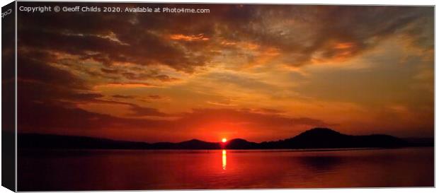  Crimson sunrise with water reflections.   Canvas Print by Geoff Childs