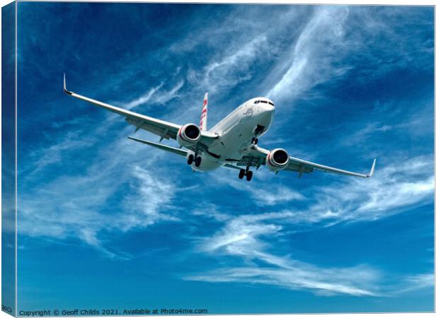 Commercial Aircraft flying among cloud. Canvas Print by Geoff Childs