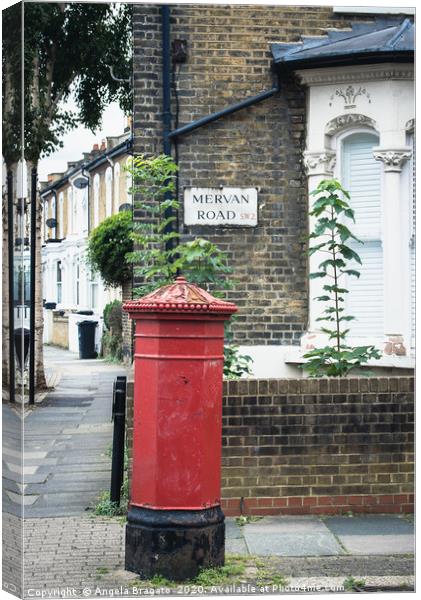 Red post box in Mervan Road, London Canvas Print by Angela Bragato