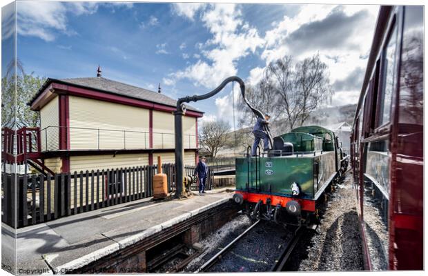 Taking on water at Keighley station. Canvas Print by Chris North