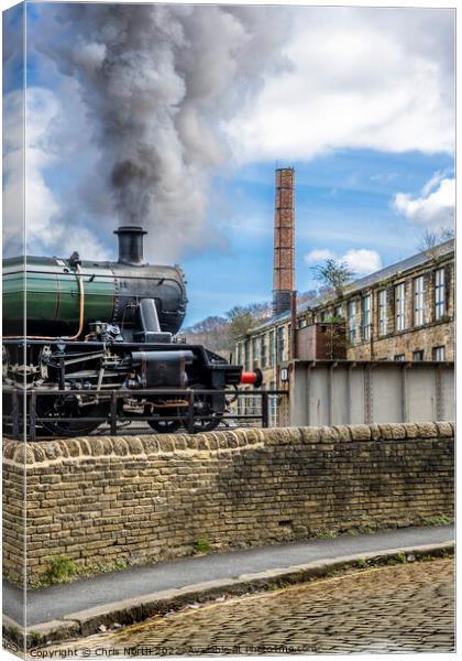 Steam engine departing Keighley station. Canvas Print by Chris North
