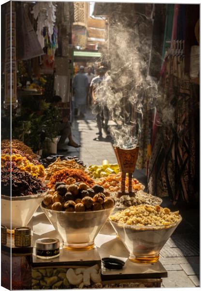 Aromatic herbs smouldering at the spice souk in Dubai. Canvas Print by Chris North