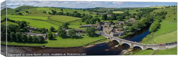 Burnsall village and the river Wharfe Canvas Print by Chris North