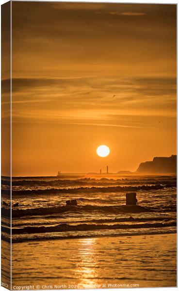 Sunrise over Whitby viewed from Sandsend. Canvas Print by Chris North