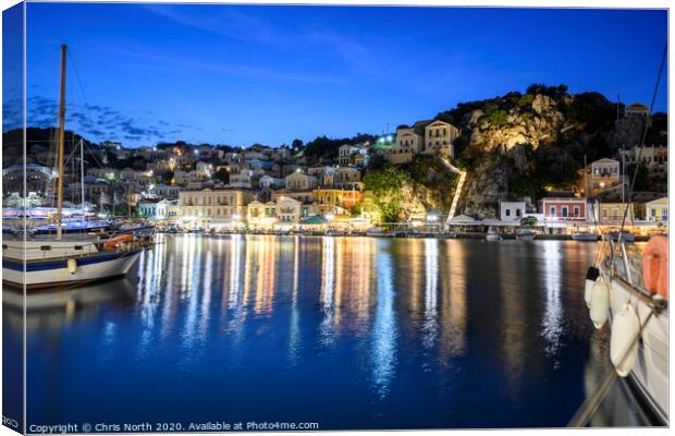Symi Harbour at night Canvas Print by Chris North