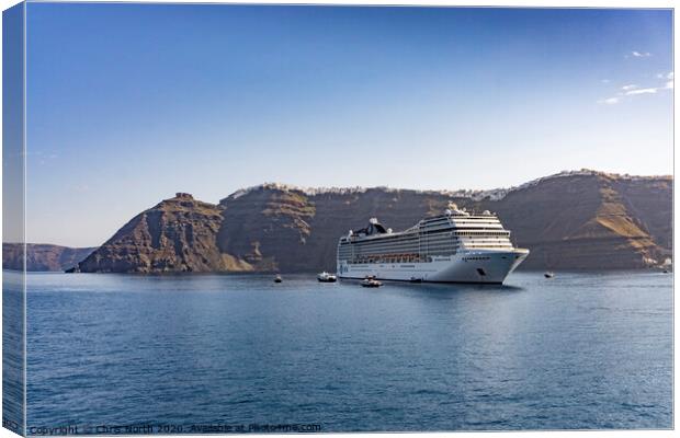 Cruise liner at anchor in Santorini Bay. Canvas Print by Chris North