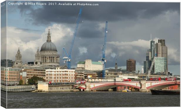 Stormy skies over the city of London Canvas Print by Mike Rogers