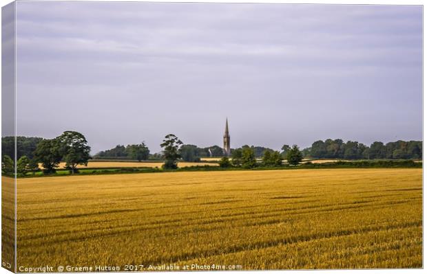 Cornfield and church at harvest time Canvas Print by Graeme Hutson