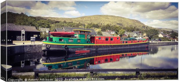 Barge on the Caladonian Canal Canvas Print by Antony Atkinson