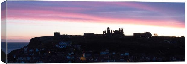 Sunrise behind Whitby famous for Dracula Stories Canvas Print by Janet Mann