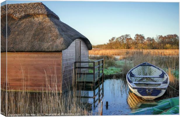 Thatched boat houses Hickling Broad Canvas Print by Jim Key