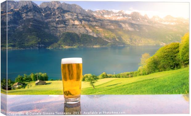 Glass of beer in a summer alpine scenery Canvas Print by Daniela Simona Temneanu