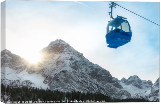 Cable car and snow-capped mountains Canvas Print by Daniela Simona Temneanu