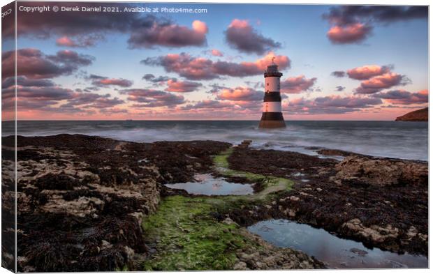 Dramatic Sunset Over Trwyn Du Lighthouse Canvas Print by Derek Daniel