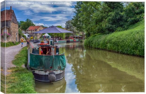 Narrowboats Reflecting In The Canal Canvas Print by Derek Daniel