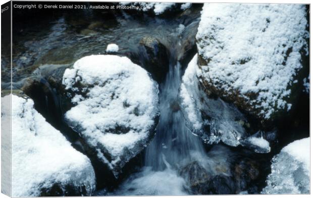 snow covered rocks Canvas Print by Derek Daniel