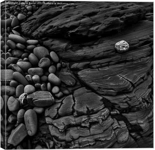 Rocks on the beach at Sandymouth (mono) Canvas Print by Derek Daniel