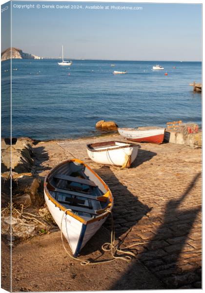 boats on the slipway at Swanage Canvas Print by Derek Daniel