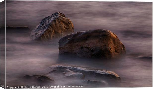 Moving water around rocks in Kimmeridge Bay Canvas Print by Derek Daniel