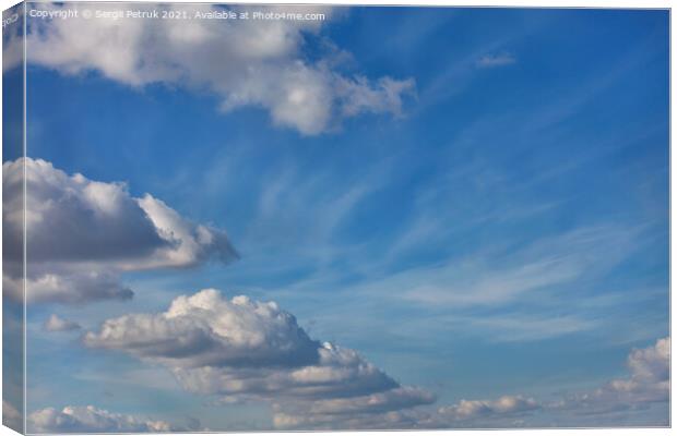 A blue sky background with a texture of white fluffy clouds Canvas Print by Sergii Petruk
