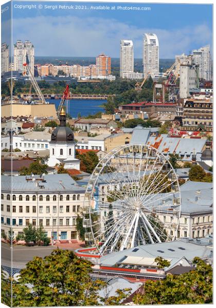 Ferris wheel and bell tower with copper roof and gilded dome in the old Podil district in Kyiv, cityscape on a summer day. Canvas Print by Sergii Petruk