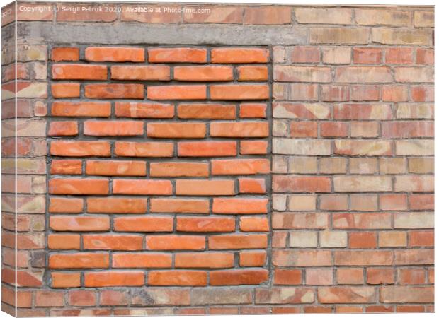 Immured bricked-up window on an old brick wall Canvas Print by Sergii Petruk