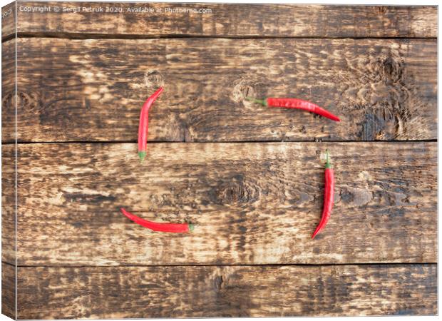 hot red peppers chili on an old wooden background Canvas Print by Sergii Petruk
