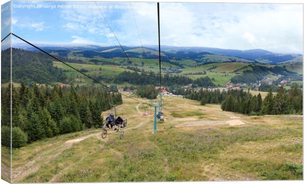 Chairlift with a mountain landscape of the Karpat mountains Canvas Print by Sergii Petruk