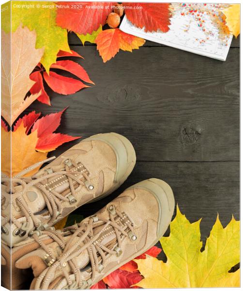 Autumn leaves, tracking boots and maps on a black background of an old tree Canvas Print by Sergii Petruk