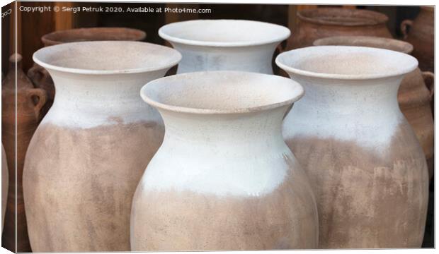 Large clay amphorae for water in a row for sale Canvas Print by Sergii Petruk